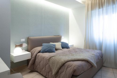 Katil atau katil-katil dalam bilik di Residenza Alma