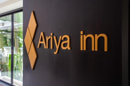 a sign for anova im on the side of a building at Ariya inn Chiangrai in Chiang Rai