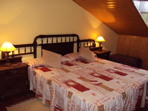 Cama o camas de una habitación en Hotel Rural Valle de Ancares