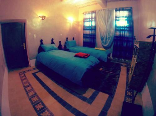 Una cama o camas en una habitación de kasbah 123 soleil