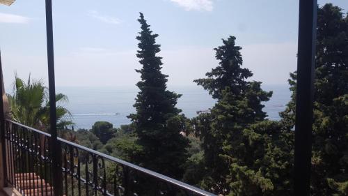 a view of the ocean from the balcony of a house at Villa Azur Cap d'Ail in Cap d'Ail