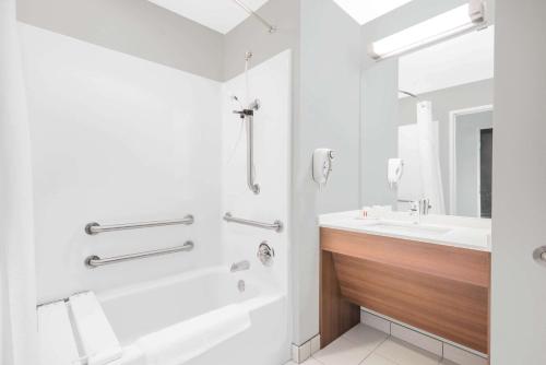 A bathroom at Microtel Inn & Suites by Wyndham Binghamton