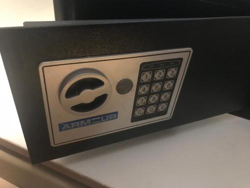 a black and white box with a remote control at Regal Inn Hotel Midrand in Midrand