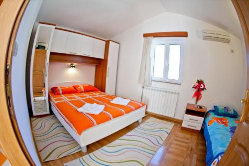 Postel nebo postele na pokoji v ubytování Apartments Stefan