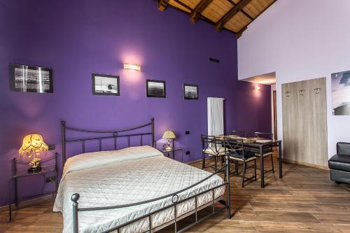 Giường trong phòng chung tại Malatesta Antica Dimora