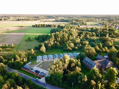 an aerial view of a group of houses and trees at Bliżej Natury in Białowieża