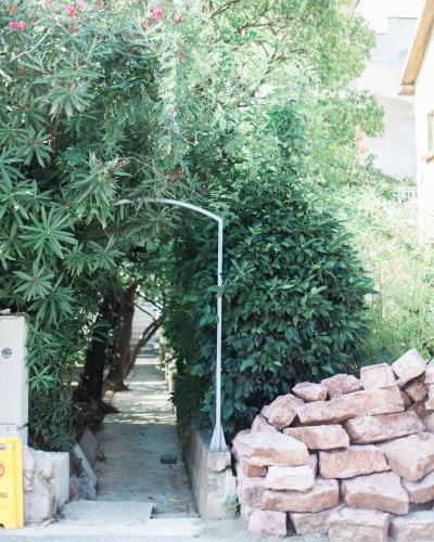 a street light next to a pile of bricks at Apartmani Tripović in Tivat