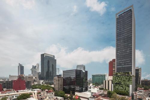 a view of a city skyline with tall buildings at Eurostars Zona Rosa Suites in Mexico City