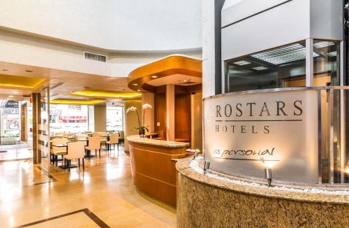 a restaurant with a sign that reads roosters huts at Eurostars Zona Rosa Suites in Mexico City