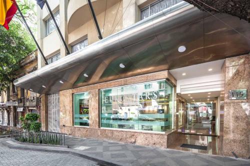 a store front of a building on a city street at Eurostars Zona Rosa Suites in Mexico City