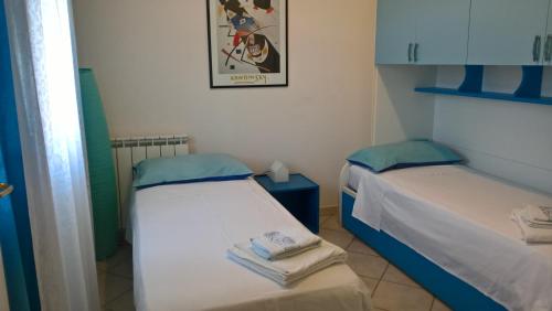 Lova arba lovos apgyvendinimo įstaigoje La Casa nel Borgo