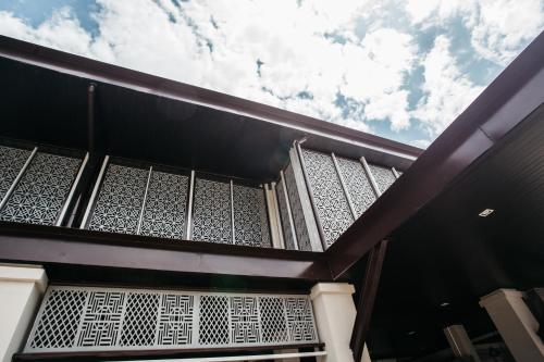 a balcony of a building with the sky in the background at Diamond Park Inn Chiangrai & Resort in Chiang Rai