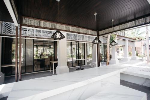 a rendering of the lobby of a building with windows at Diamond Park Inn Chiangrai & Resort in Chiang Rai