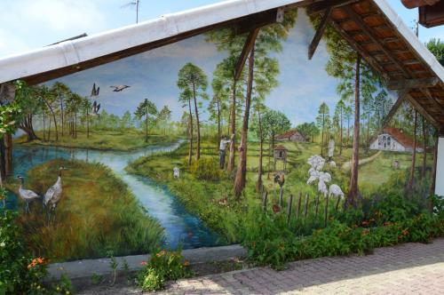 a mural of a forest with a river at a2pasdelaforet in Morcenx