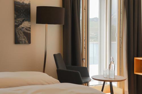 Ένα ή περισσότερα κρεβάτια σε δωμάτιο στο Hotel Grimsel Passhöhe