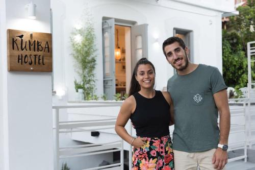 a man and a woman standing in front of a house at Kumba Hostel in Chania Town