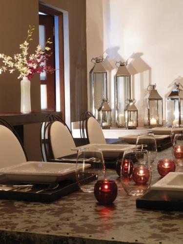a table with wine glasses and candles on it at Krystal Grand Cancun All Inclusive in Cancún