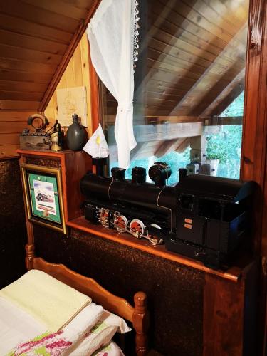 an old radio sitting on a shelf in a room at Apartments DM in Mokra Gora