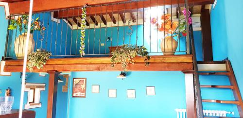 a room with a balcony with plants on it at Agriturismo Arcobaleno della Torretta in Giano dellʼUmbria