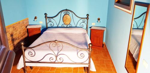 a bedroom with a bed in a room at Agriturismo Arcobaleno della Torretta in Giano dellʼUmbria
