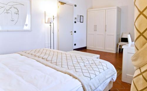 Ένα ή περισσότερα κρεβάτια σε δωμάτιο στο Hotel San Miniato