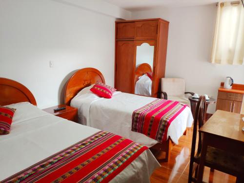 Кровать или кровати в номере Casa Kuelap Hostal