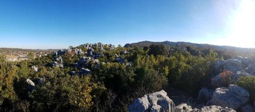 an aerial view of a mountain with trees and rocks at Chez Albert et Karine in Sauve