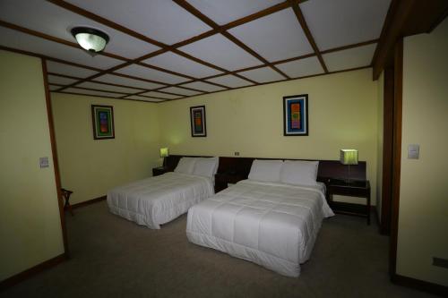 Ένα ή περισσότερα κρεβάτια σε δωμάτιο στο Hotel Villa Tournon