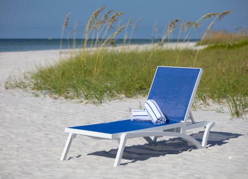 a blue and white chair on the beach at Sanibel Island Beach Resort in Sanibel