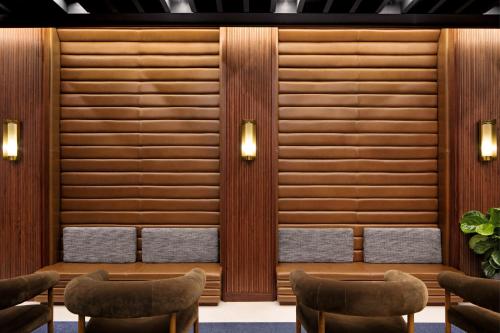 a waiting room at a hotel with benches and lights at Eaton DC in Washington