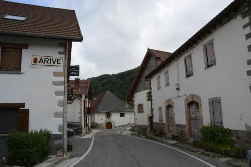 an empty street in a village with a street sign at Casa Rural Teodoro Barrio in Aribe