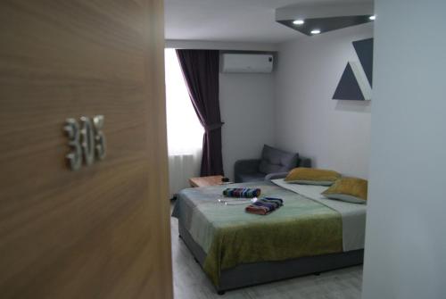 A bed or beds in a room at Moon Hotel Şirinevler