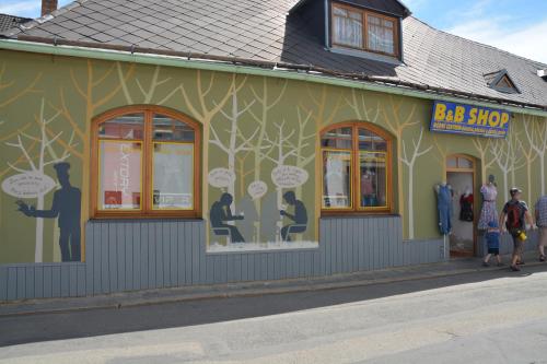 a building with people standing outside of it at Penzion U Šelongů in Jindrichuv Hradec