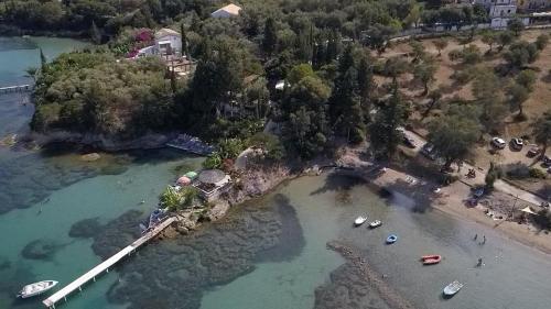 an aerial view of a beach with boats in the water at Pension Elena in Ágios Nikólaos