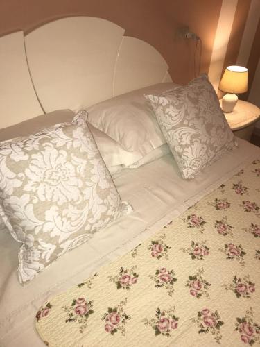 a bed with two pillows on top of it at B&B Amy&Julie in Badia Polesine
