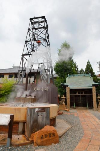 a metal structure with smoke coming out of it at Brücke Arima KOBE in Kobe