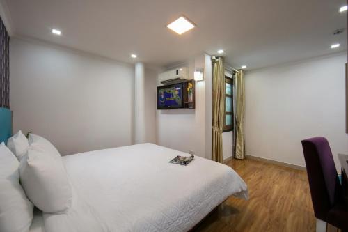 Кровать или кровати в номере golden time hostel
