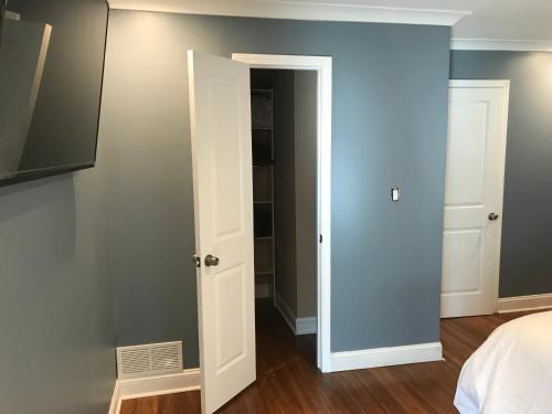 a bedroom with a door leading to a closet at Flint Hill in Acworth