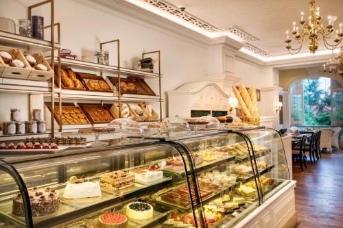 a bakery with a display case filled with pastries at Artyzen Grand Lapa Macau in Macau
