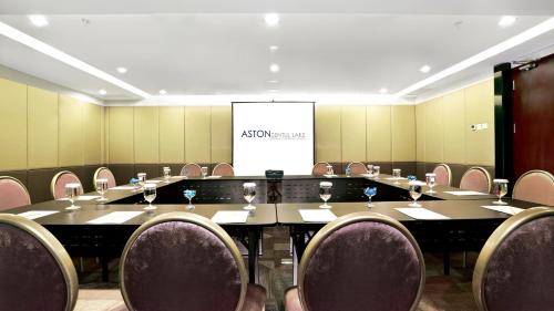 a conference room with a large table and chairs at Aston Sentul Lake Resort & Conference Center in Bogor