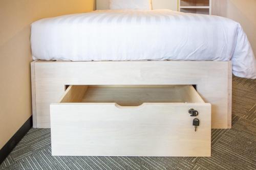 a bunk bed with a drawer underneath it at Kuretake Inn Gotemba Inter Gold Cabin in Gotemba