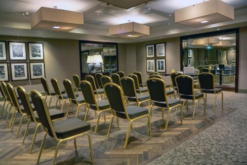 a row of chairs in a room with a waiting room at Best Western Garfield House Hotel in Chryston