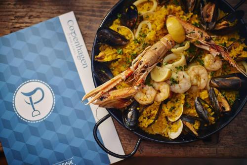 a plate of food with shrimp and mussels on a table at Best Western Hotel de Havelet in St Peter Port