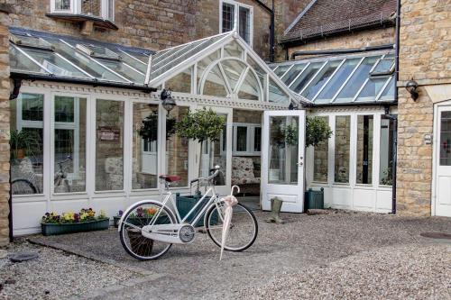 a bike parked in front of a house at The Grange at Oborne in Sherborne