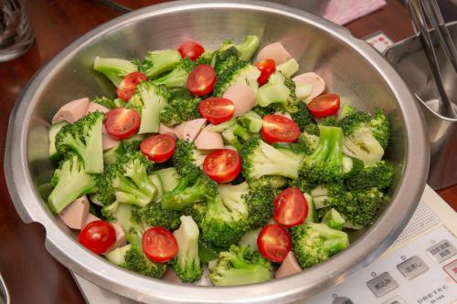 a pot filled with broccoli tomatoes and broccoli broccoli at Kuretake Inn Gotemba Inter Gold Cabin in Gotemba