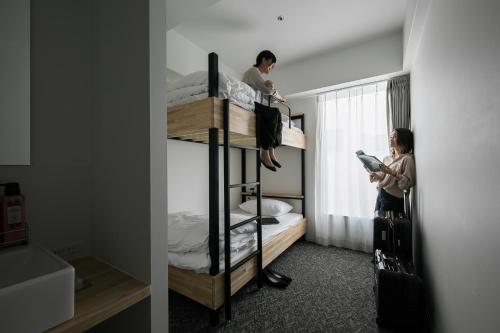 Una cama o camas en una habitación de Imu Hotel Kyoto