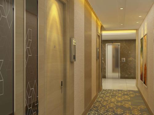 a hallway of a hotel with a hallwayngth at Days Hotel Jaipur Tonk Road By Wyndham in Jaipur