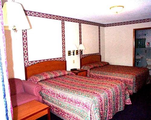 Wesley Inn & Suitesにあるベッド