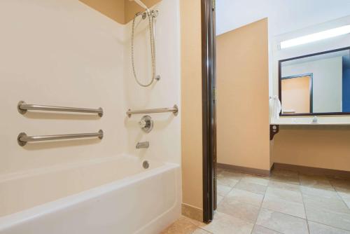 a bathroom with a shower stall and a toilet at Super 8 by Wyndham Fairfield in Fairfield