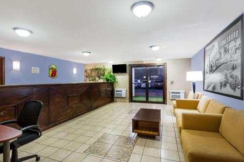 a lobby of a hospital with a waiting room at Super 8 by Wyndham Jonesboro in Jonesboro